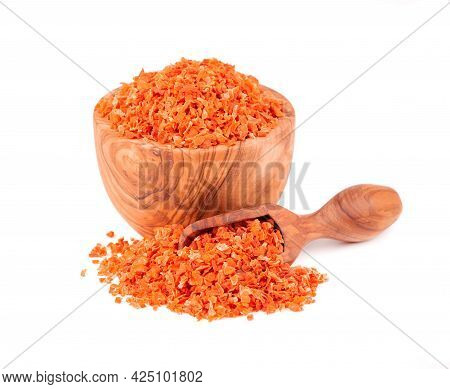 Dry Carrot In Olive Bowl And Scoop, Isolated On The White Background. Chopped Dried Carrot. And Herb