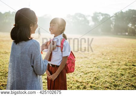 Primary School Student Taken By Mother To School In The Morning