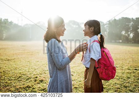 Primary School Student Taken By Mother To School In The Morning