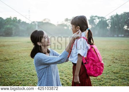 Primary School Student Taken By Mother To School In The Morning