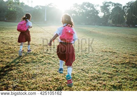 Little Girl Student Running Together While Going To Their School