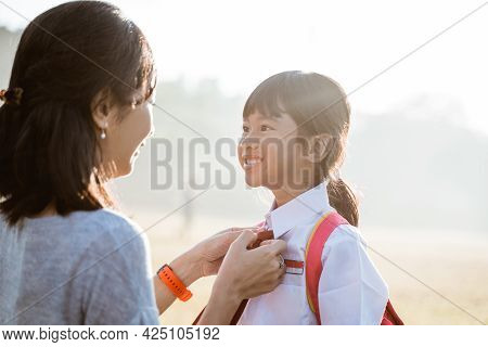 Primary School Student Taken By Mother To School In The Morning