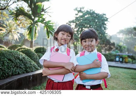 Happy Student Friend In Uniform Smiling To Camera