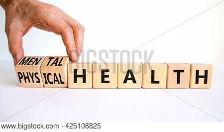 Mental Or Physical Health Symbol. Doctor Turns Wooden Cubes And Changes Words Physical Health To Men