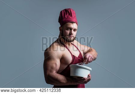 Feels Hunger. Food For Athletes. Sexy Man With Body Muscles In Cook Apron. Professional Handsome Che