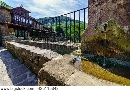 Crystal Clear Water Source In Old Village Of Stone Houses. Barcena Mayor Santander.