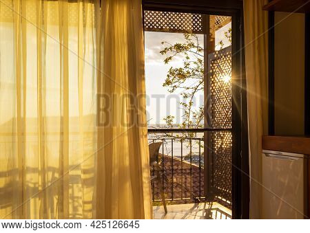 Sun Shining Into The Room Through The Balcony