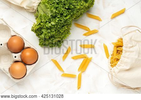 Eggs, Salat And Pasta In Eco Package On White Cement Background.zero Waste Cconcept. Package-free Fo