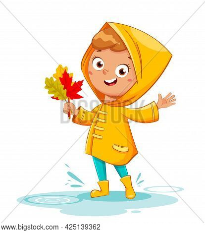 Happy Funny Child In Yellow Raincoat And Rubber Boots Holding Leaves, Rainy Autumn. Cheerful Girl Ca