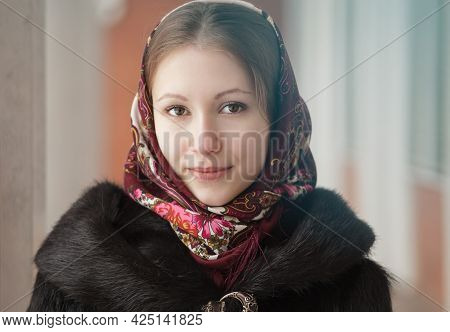 Portrait Of Young Beautiful Woman In Russian Folk Patterned Shawl, Outdoor.
Traditional Headscarf. R