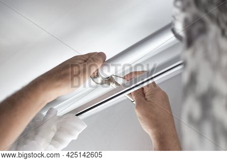 Installation Of A Curtain Rod With Curtains Over The Window. Hang Curtains, Home Renovation And Apar
