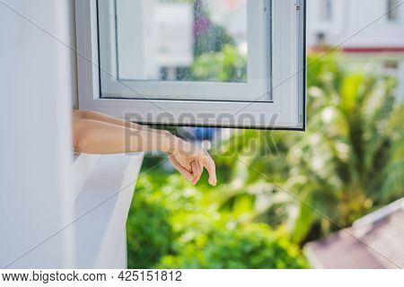 Extremly Tired Woman Looking Out The Window, Home Alone. Self-isolation At Home, Quarantine Due To P
