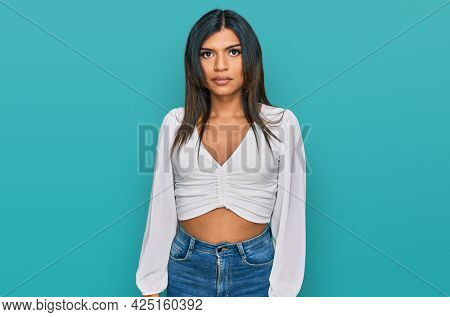 Young latin transsexual transgender woman wearing casual clothes depressed and worry for distress, crying angry and afraid. sad expression. 