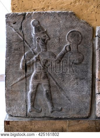 Berlin, Germany - 18 September 2019: Part of Babylonian bas relief in Berlin Pergamon museum in Germany. Historical ancient art of east religion and civilization.