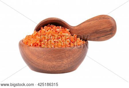 Dry Carrot In Wooden Bowl And Spoon, Isolated On The White Background. Chopped Dried Carrot. And Her