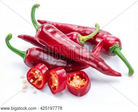 Fresh red chilli pepper and cross sections of chilli pepper with seeds isolated on white background.