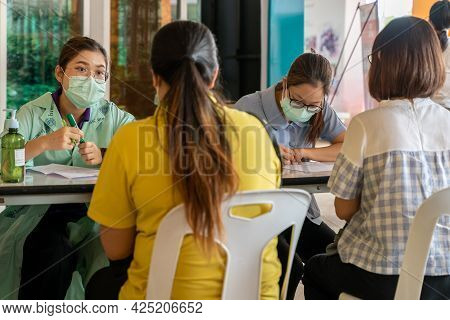 Chiang Mai, Thailand - 28 June 2021 - Thai Nurses Check People Information Before Sending Them In To