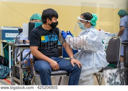 Chiang Mai, Thailand - 28 June 2021 - A Thai Man Get His Covid-19 Vaccine In Chiang Mai, Thailand