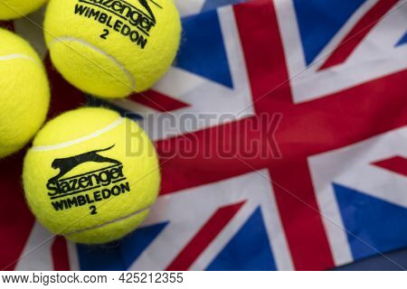 London, Uk - June 2021: Official Wimbledon Tennis Slazenger Ball On Uk Flag