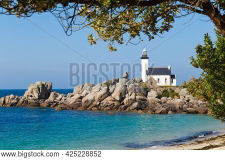 Pontusval Lighthouse on rocky shore in Kerlouan, northern Brittany, France