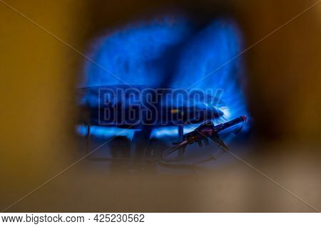 Pilot Light Auto Igniter Inside A Hot Water Heater With Flames