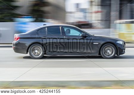 Moscow, Russia - May 2021: Bmw 5 Series On The Road In Motion. Fast Speed Drive On City Road. Side V