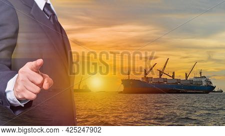Business Man Wearing A Suit Point Finger Forward On Image Large Cargo Ship For Transportation Import