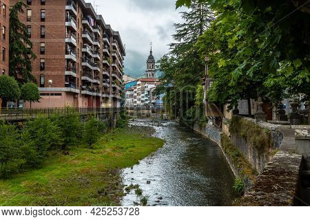 Traditional Houses In The Town Of Azkoitia Next To The Urola River And Church Of Santa María La Real
