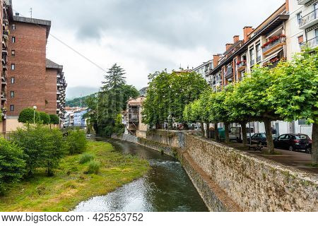 Traditional Houses In The Town Of Azkoitia Next To The Urola River And Church Of Santa María La Real