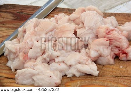 Raw Lamb Fat Cut Into Large Chunks Close-up, Dumba, On A Wooden Board, Cooking Food