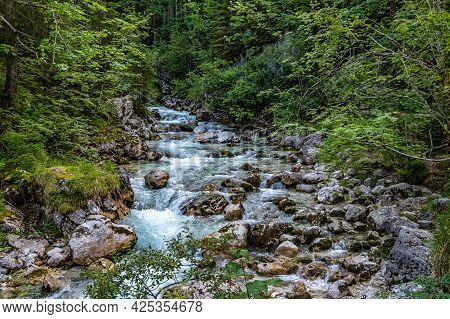 Magic Forest Zauberwald At Lake Hintersee With Creek Ramsauer Ache. National Park Berchtesgadener La