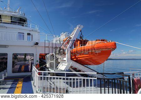 Bjornafjord, Norway - July 23, 2020: Lifeboat On A Car Ferry Crossing Bjornafjord In Norway. Public 