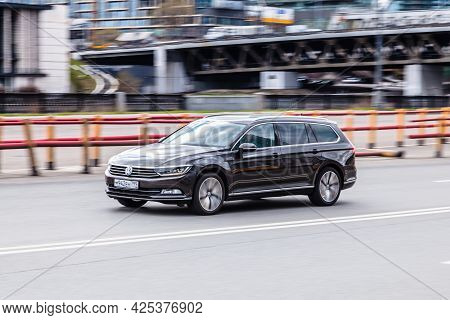 Moscow , Russia - May 2021: Side View Rolling Shot With Black Volkswagen Passat B8 Variant Driving A