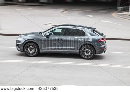 Moscow, Russia - May 2021: Audi Q8 Car Driving In City With Motion Blur, View From The Side