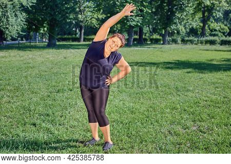 Lateral Flexion For An One Obese Mature Woman Or Fitness Exercise Side Bends.