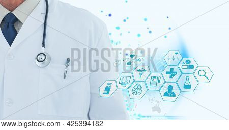 Mid section of male doctor against medical icons and blue spots on white background. medical research and science technology concept