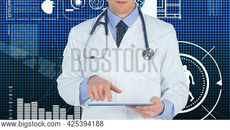 Mid section of male doctor using digital tablet against medical data processing on blue background. medical research and science technology concept