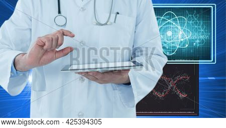 Mid section of male doctor holding digital tablet against medical data processing on blue background. medical research and science technology concept