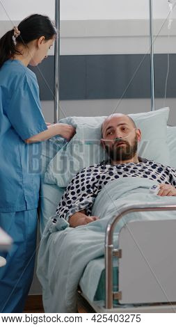 Practitioner Asisstant Arrange Patient Bed To Sick Man During Sickness Recovery Monitoring Disease S