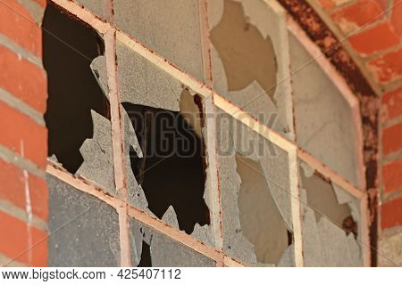 Close Up Of Muntin Window With Broken Glass Of Old Abandoned Building