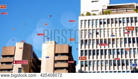 Image of social media icons and text on multi coloured banners over cityscape. global social media network, digital interface and technology concept digitally generated image.