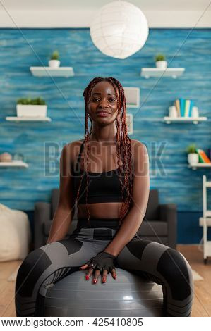 Happy Joyful Smiling African Woman Relaxing On Swiss Ball, After Intense Hard Sport Workout On Yoga 