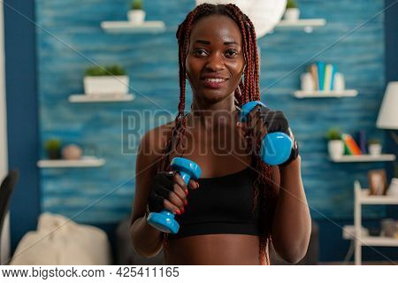 Black Woman Taking Care Of Body Working Training Arm Muscles Using Dumbbells Weights During Workout.