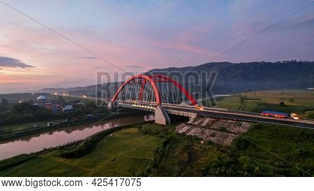 Aerial View Of The Kalikuto Bridge, An Iconic Red Bridge At Trans Java Toll Road, Batang When Sunris