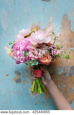 Woman holding a bouquet of flowers