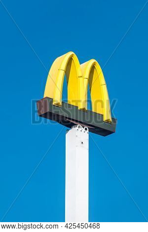 Pila, Poland - May 31, 2021: Mcdonald Sign Board On Blue Sky.