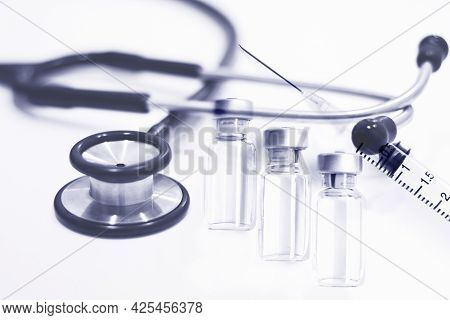 Vial Of Drugs Or Vaccine, 3 Ml Plastic Syringe With Needle And Stethoscope