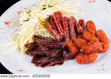 Beer Appetizer: Cecil Cheese, Picolini Sausages, Sujuk, Jorki. Plate With Delicious Sliced Smoked Sa