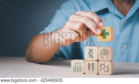 Doctor's Hand Stack Woods Block Step On Table With Health Care And Medical Icon,concept Is Online An