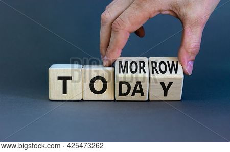 Do It Today Not Tomorrow. Businessman Turns Wooden Cubes And Changes The Word 'tomorrow' To 'today'.